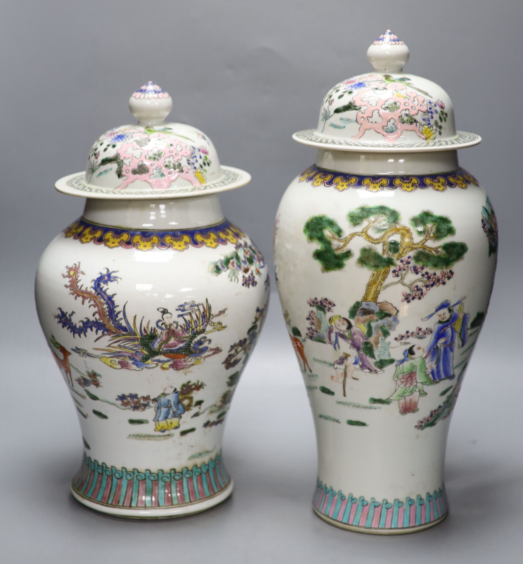 Two Chinese famille rose vases and covers, tallest 47cm